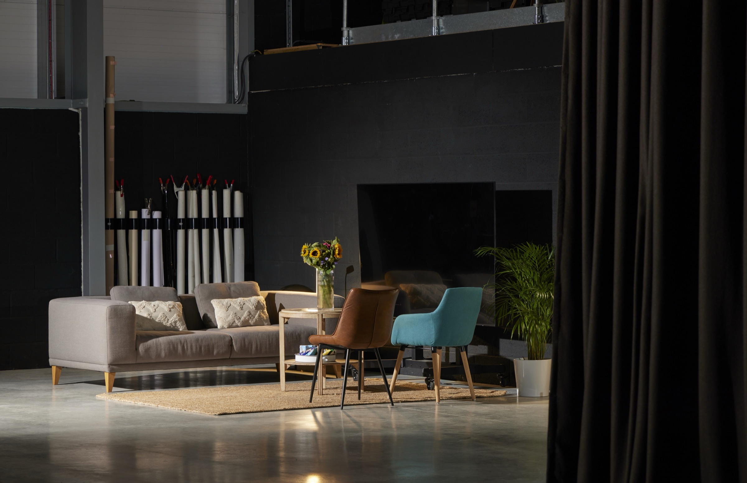 The client lounge under the mezzanine, seen from the shoot floor