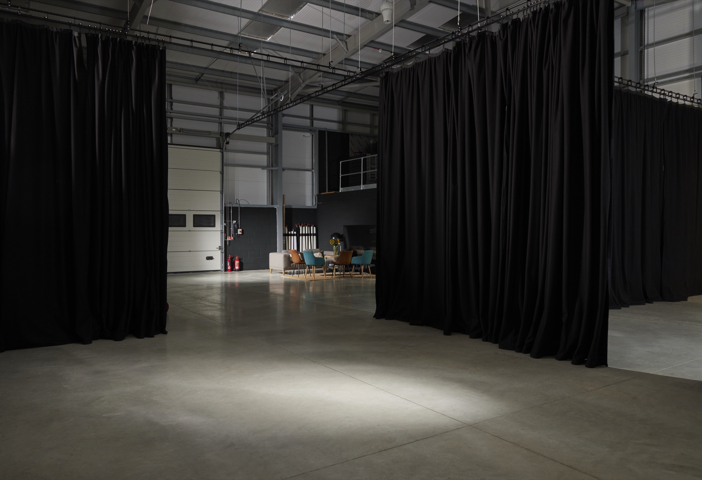 Looking through the studio curtains towards the client lounge and loading door
