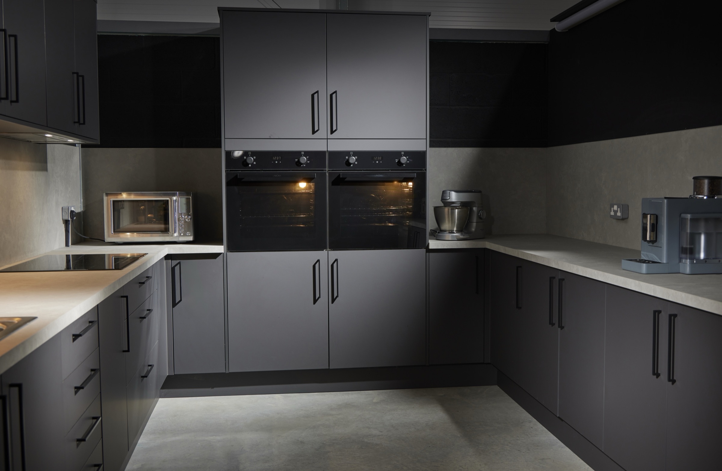 Twin built-in ovens, induction hob, stand mixer and coffee machine in the Hopclover One kitchen