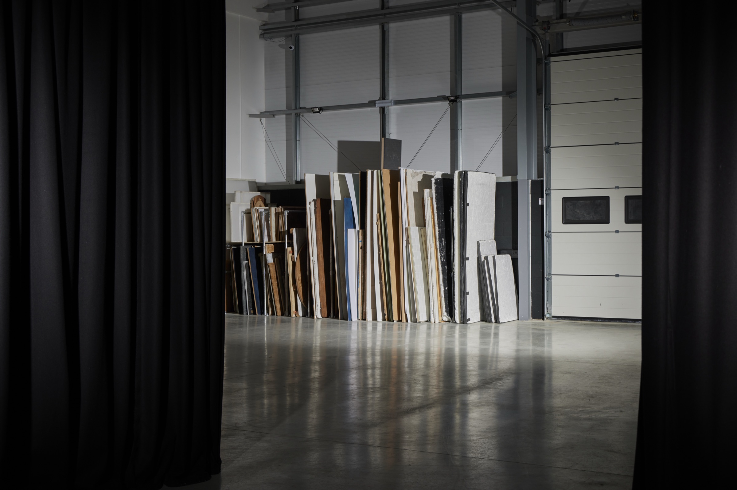 The surfaces rack: dozens of hand-built painted boards and tabletops